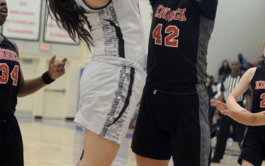 Zama's Jessica Atkinson shoots against Nile C. Kinnick's Madelyn Gallo.