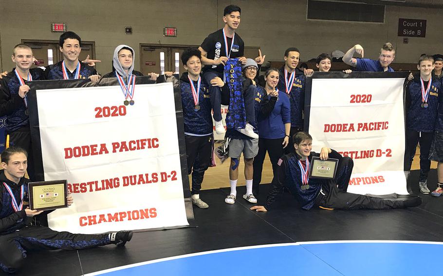 Banner time for Yokota's Far East Division II wrestling champions.