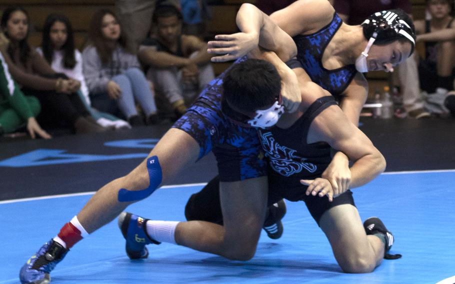 Yokota's Chris DeGrella gains the upper hand on Perry's Jaythan Baythavong en route to a pin in 2 minutes, 2 seconds at 129 pounds.