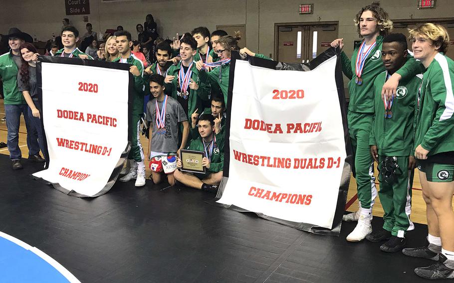 Banner time for Kubasaki's Far East Division I wrestling champions.