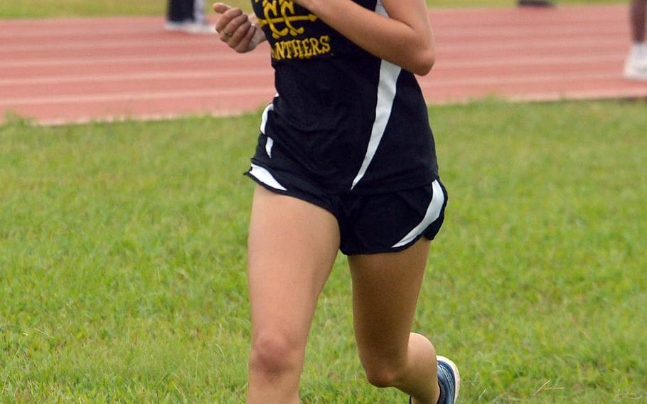 Kadena sophomore Karise Johnson closes in on the finish line during Friday's Okinawa cross country race at Kadena Air Base. Johnson won in 21 minutes, 21.64 seconds, her second straight victory.