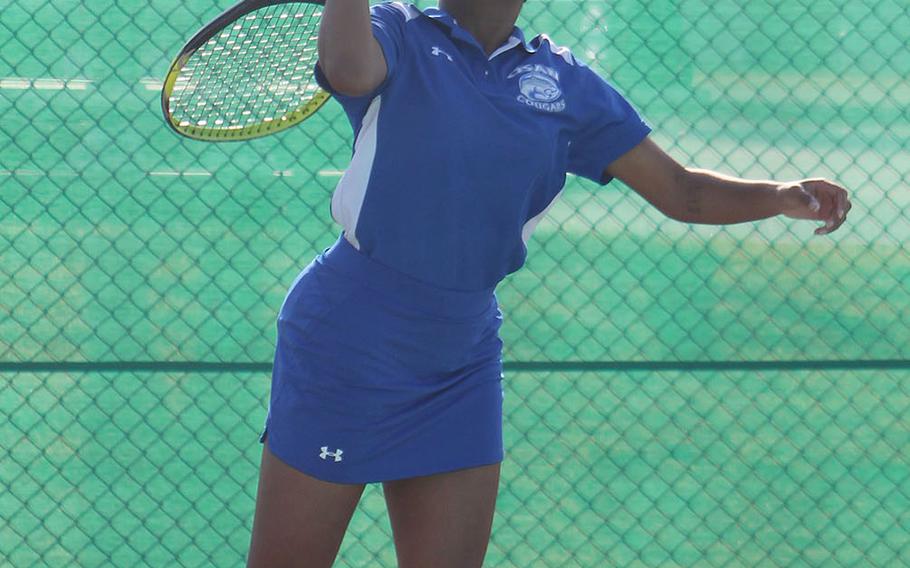 Osan's Layla Barker serves against Humphreys' Ashley Kim during Friday's DODEA-Korea season-opening tennis matches. Kim won 8-1.