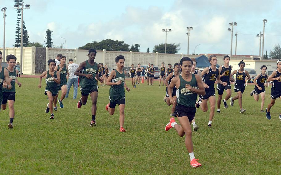 Kubasaki's Arthur Parra leads the pack off the start line of Friday's Okinawa boys cross country race. Parra won for the fifth straight week, clocking 17 minutes, 24. 91 seconds.