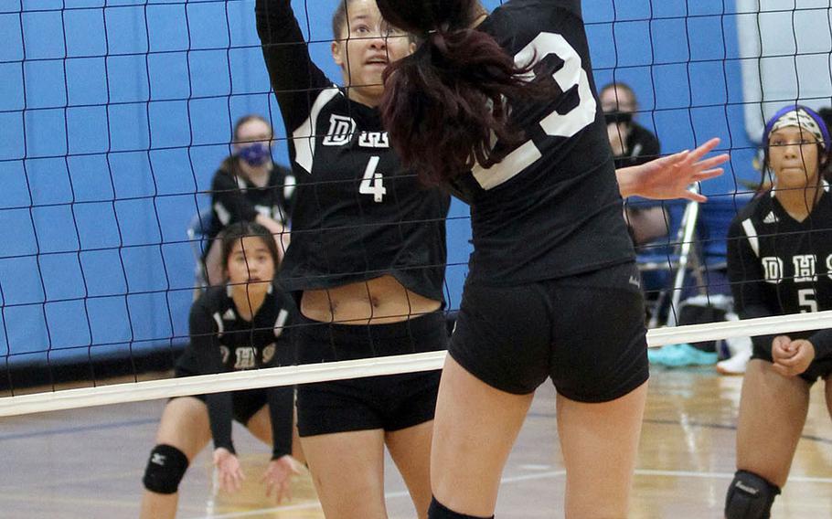 Daegu's Issamoly Thurman goes up to block against Osan Black's Shaylee Ungos during Friday's DODEA-Korea girls volleyball. Osan Black beat the Warriors 22-25, 25-23, 25-21.