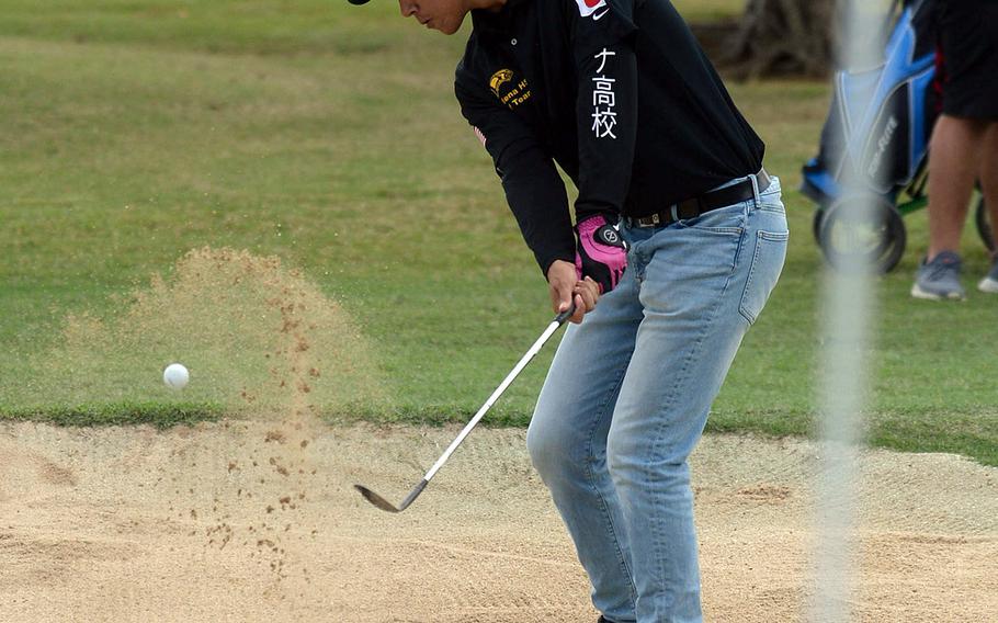 Kadena's Austin Barnes blasts out of a bunker near the third green during Thursday's Okinawa golf at Chibana's par-3 course. Barnes shot 36 and finished third.