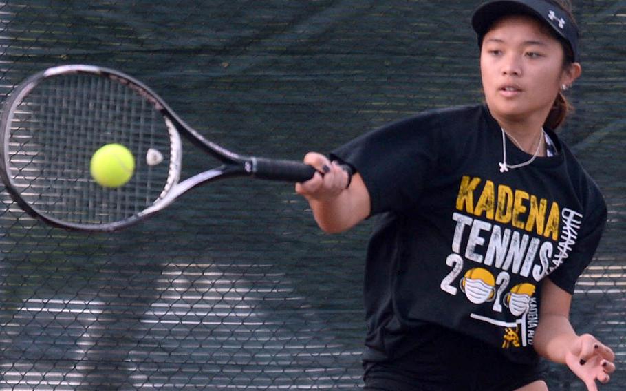 Kadena senior Mayann Rivera smacks a forehand return against teammate Noelle Asato during a knockout-bracket match Wednesday in the Okinawa district singles tennis tournament. Asato eliminated Rivera 6-4.