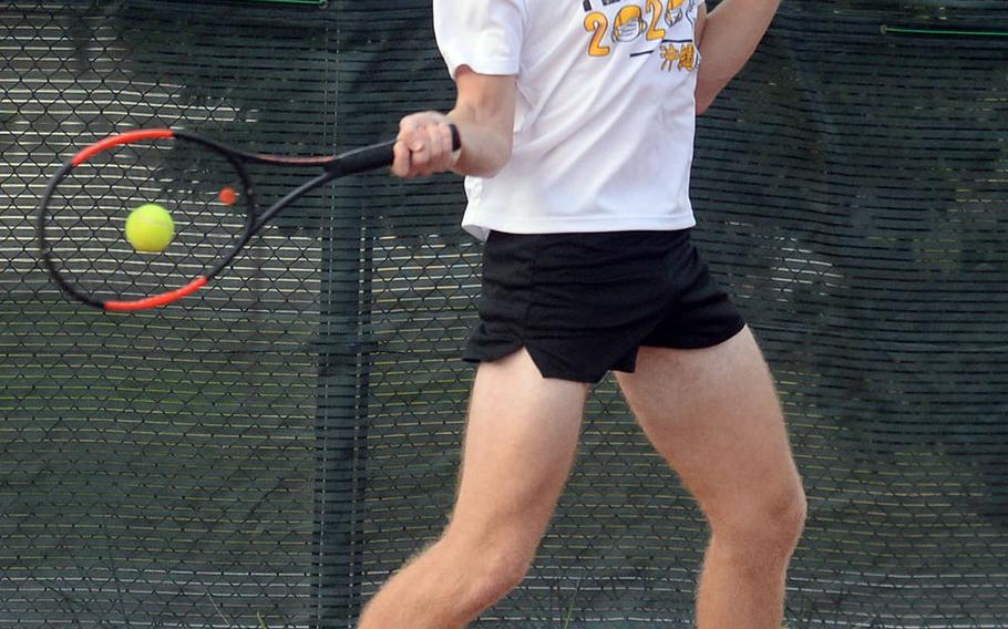 Kadena senior R.J. Smola rips a forehand return against teammate Brett Davis during a knockout-bracket match Wednesday in the Okinawa district tennis singles tournament. Smola won in a tiebreak 7-6 (8-6).