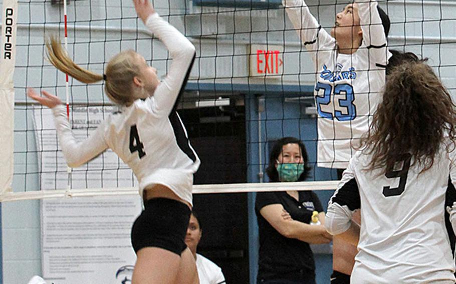 Humphreys' Zoe Weidley and Osan's Shaylee Ungos battle for the ball during Wednesday's DODEA-Korea volleyball match. Osan's Black team swept Humphreys' Gold and Black teams in two three-set matches. Humphreys' teams repaid the favor, beating Osan Blue in a pair of two-set matches.