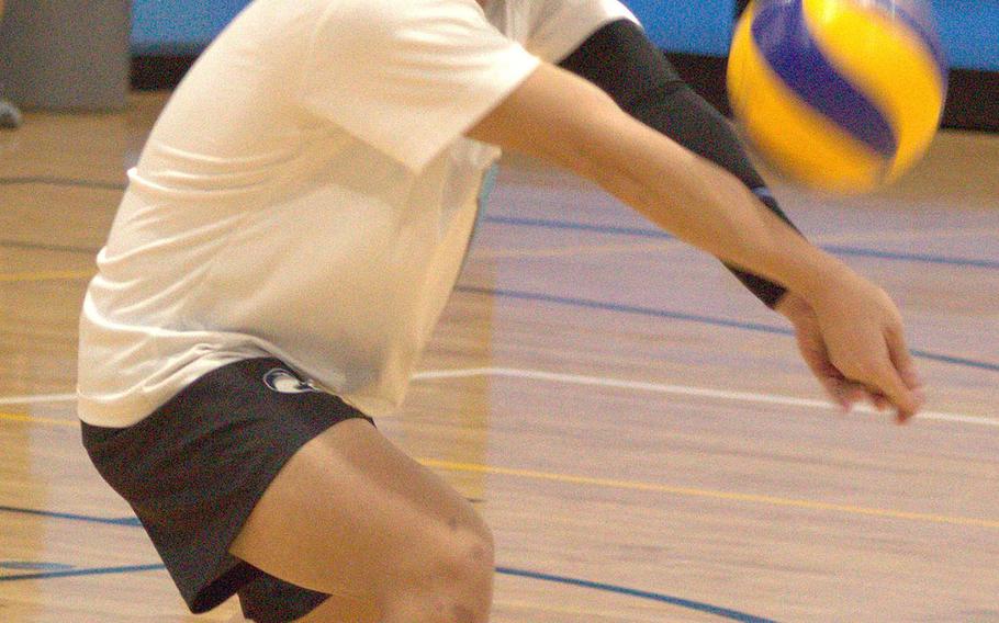 Osan's Stephen McCool bumps the ball against Humphreys during Wednesday's DODEA-Korea volleyball. The Cougars swept two matches, beating Humphreys Gold 25-20, 27-25 and Humphreys Black 25-21, 28-26.
