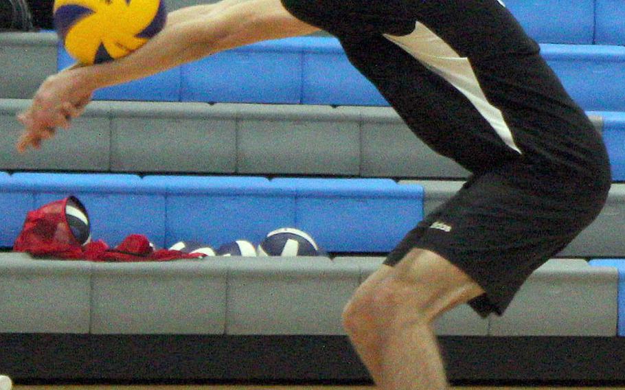 Humphreys' Chase Tabor bumps the ball against Osan during Wednesday's DODEA-Korea volleyball. The Cougars swept two matches, beating Humphreys Gold 25-20, 27-25 and Humphreys Black 25-21, 28-26.