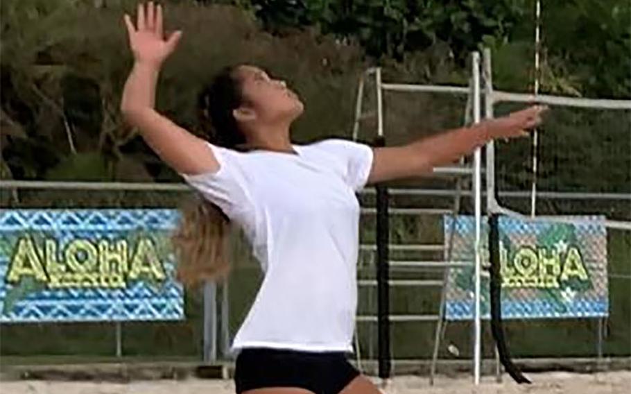 Ryleen Castro of Guam High's Gold team serves against St. John's Red team during Wednesday's Guam beach volleyball matches. The Knights won the A match, and the Panthers took the B and C matches.