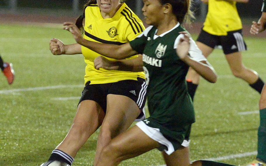 Kubasaki's Natalie Oboza and Kadena's Mikayla Benitez chase down the ball during Friday's Okinawa girls soccer match. The Panthers won 3-0.