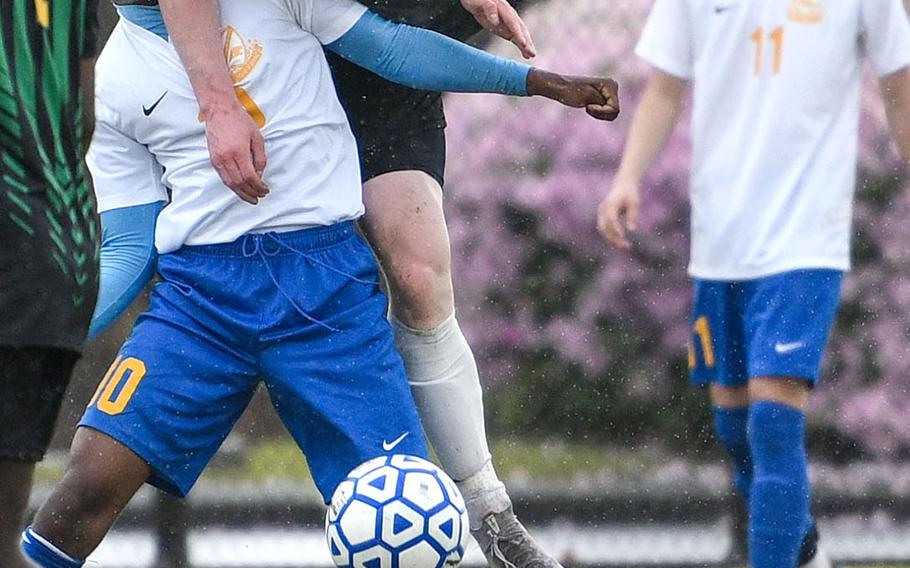 Robert D. Edgren's Ethan Hovenkotter collides with Yokota's Devin Martin during Saturday's DODEA-Japan boys soccer matches. The Panthers won 9-1 and 6-0.