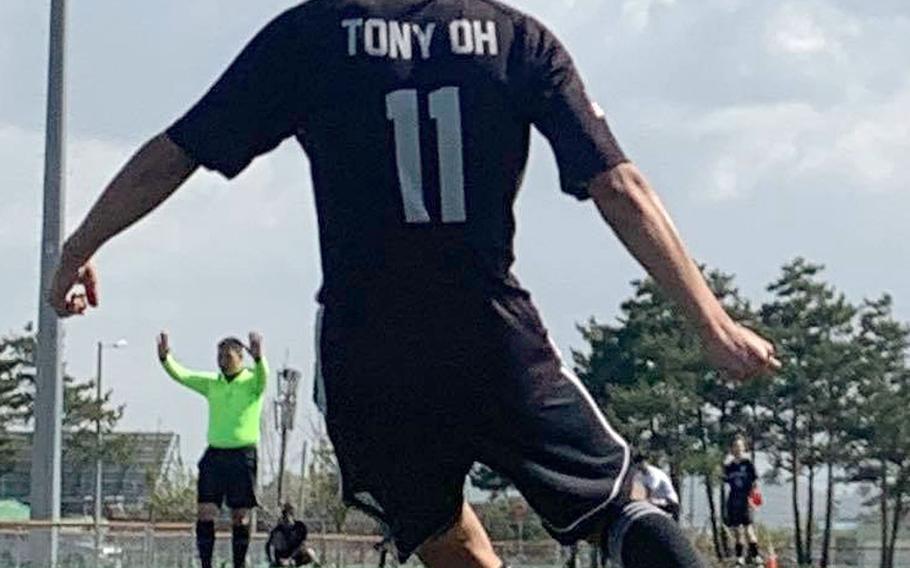 Humphreys' Tony Oh unleashes a corner kick during Saturday's DODEA-Korea boys soccer matches. Oh scored twice and added an assist as the Blackhawks routed Daegu 7-0 and Osan 7-1 to capture the regular-season title with an unblemished 6-0 record.