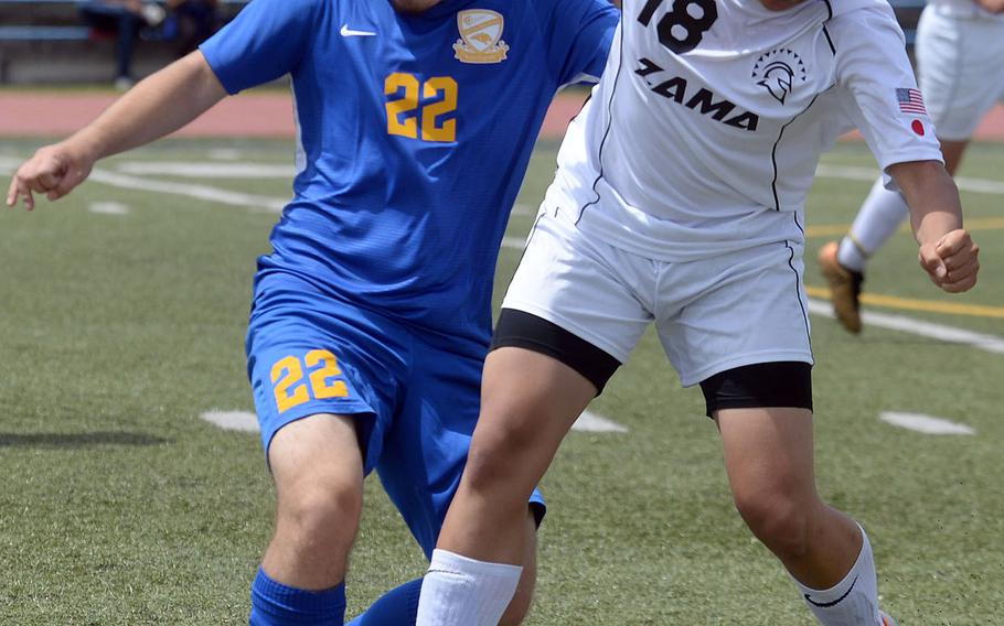 Zama's Kaisei Muta and Yokota's Joey Nishida battle for the ball during Saturday's DODEA-Japan boys soccer match. The Trojans and Panthers played to a 2-2 draw.