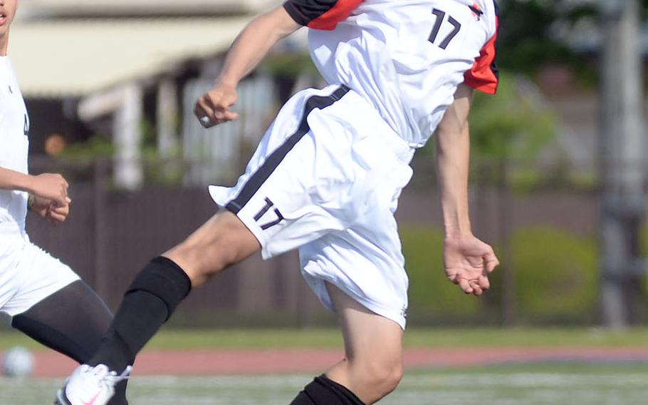 Nile C. Kinnick's Aiden Florespena heads the ball against Yokota during Saturday's DODEA-Japan boys soccer match. The Red Devils allowed a goal for the first time this season, but beat the Panthers 3-1.