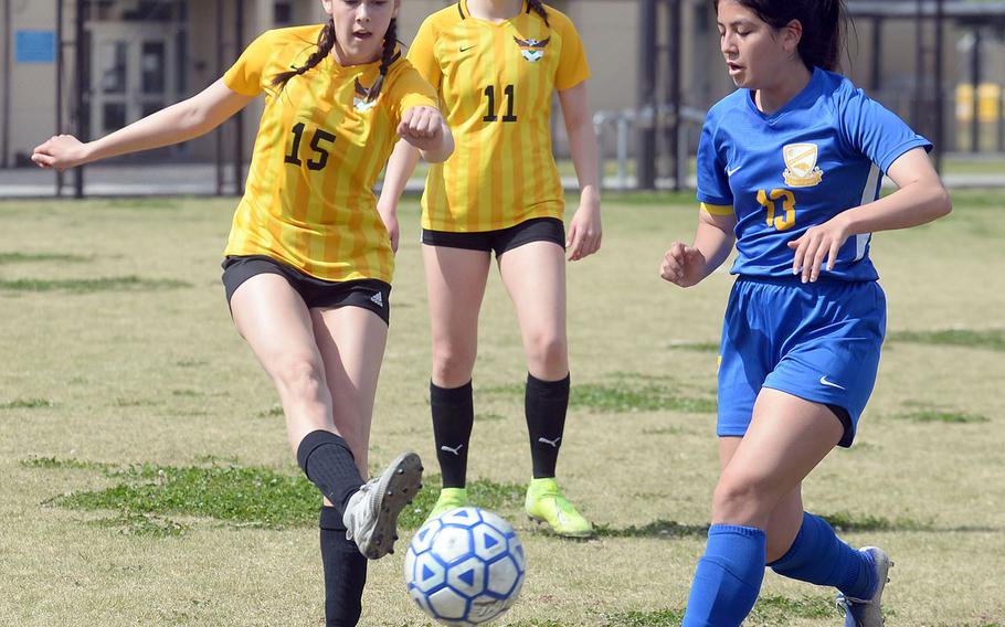 Robert D. Edgren's Maya Smith boots the ball past Yokota's Keiya Carlson during Saturday's DODEA-Japan girls soccer match. The Eagles beat the Panthers 3-1, and Yokota rebounded for a 5-1 win to split the series.