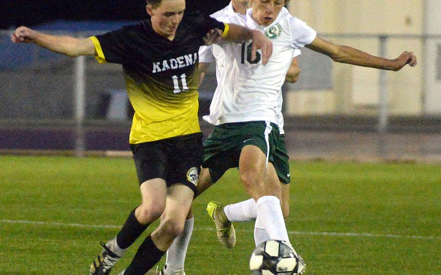 Kadena's Nathan Funkhouser and Kubasaki's Jacob Czepiel battle for the ball during Thursday's DODEA-Okinawa boys soccer season finale. The Dragons won 1-0, capturing the season series 3-1 with one draw.