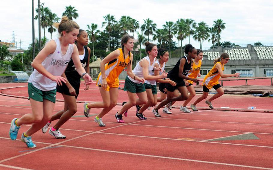 Competitors take off at the beginning of the girls 1,500 meter race at the Okinawa Activities Council Track Meet held at Koza Stadium on Friday afternoon. Teauna Baker from Zion Christian Academy won the race with a time of 5 minutes and 34 seconds.
