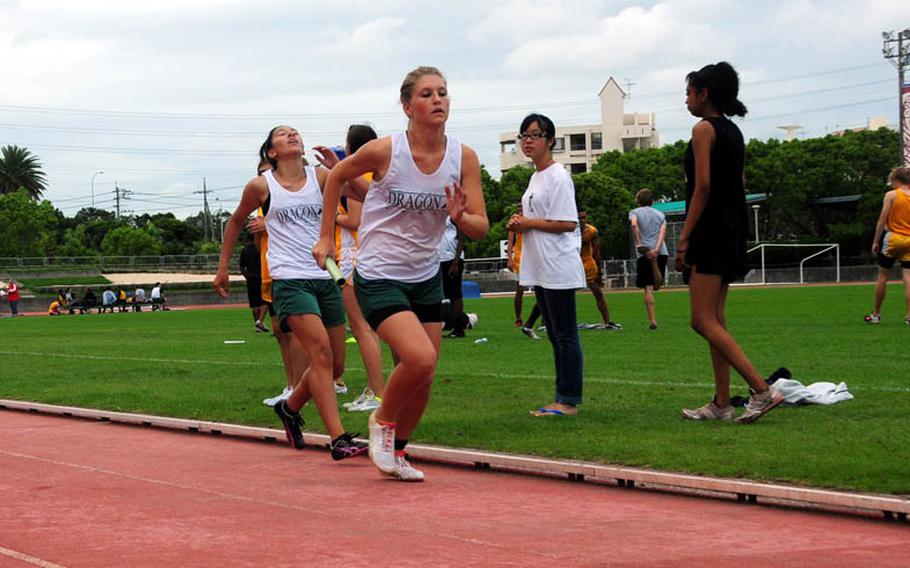 Kubasaki's Dominique Lopez passed the baton to Tyeler Cyr in the 4X800 Meter relay. Zion Christian Academy won the race in a time of 11 minutes and 3 seconds.