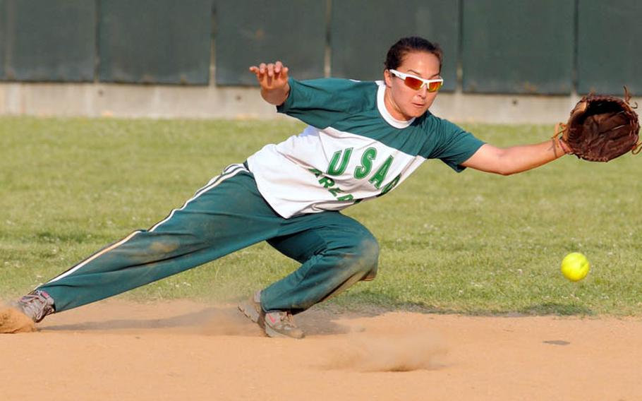 Daegu/Area IV shortstop Jen Farley dives for a ground ball off an Osan Air Base bat during Sunday&#39;s champion bracket game in the women&#39;s double-elimination playoff game in the 21st Pacificwide Open Interservice Softball Tournament at Field 3, FourPlex at Lombardo Field, South Post, Yongsan Garrison, South Korea. Osan edged Daegu 10-9.