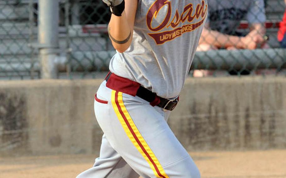 Four-time All-Air Force outfielder Candace Dugo of the Osan Mustangs watches the flight of a popup against Daegu/Area IV during Sunday&#39;s champion bracket game in the women&#39;s double-elimination playoff game in the 21st Pacificwide Open Interservice Softball Tournament at Field 3, FourPlex at Lombardo Field, South Post, Yongsan Garrison, South Korea. Osan edged Daegu 10-9.