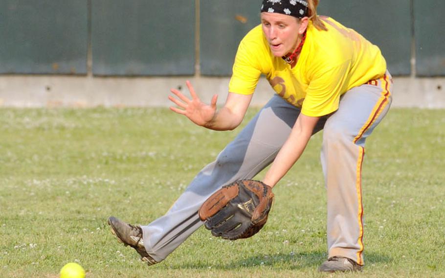 Osan Air Base shortstop Erin Moretti fields a ground ball off a Daegu/Area IV bat during Sunday&#39;s champion bracket game in the women&#39;s double-elimination playoff game in the 21st Pacificwide Open Interservice Softball Tournament at Field 3, FourPlex at Lombardo Field, South Post, Yongsan Garrison, South Korea. Osan edged Daegu 10-9.