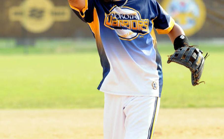 Yokota Warriors pitcher Ben Whitehead delivers against Osan Air Base during Sunday&#39;s knockout bracket game in the men&#39;s A double-elimination playoff game in the 21st Pacificwide Open Interservice Softball Tournament at Field 1, FourPlex at Lombardo Field, South Post, Yongsan Garrison, South Korea. Yokota eliminated Osan 16-14. Whitehead is one of three pitchers who wear catchers&#39; masks in the tournament.