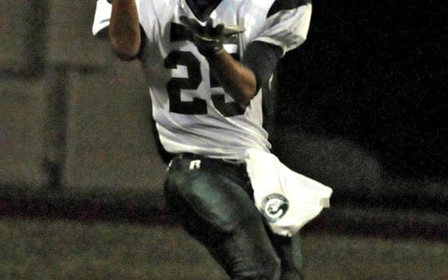 Kubasaki Dragons running back Jace Johnson hauls in a Cristian Rivera 23-yard touchdown pass against the Zama American Trojans during Saturday's interarea high school football game at Zama American High School, Japan. Kubasaki won 48-9 to improve to 3-0 in interarea play this season.