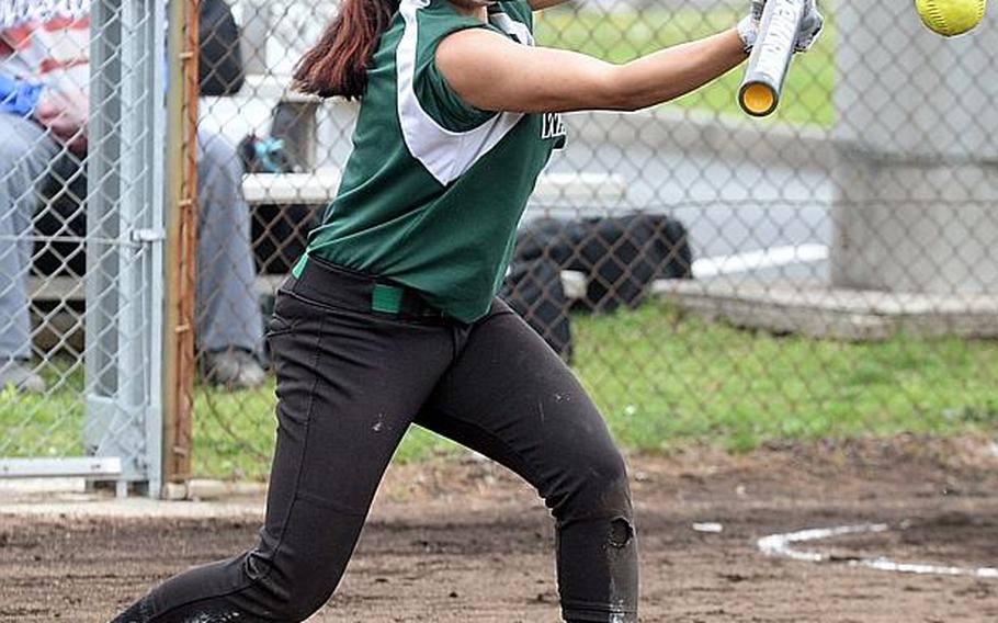 Daegu's Kaitlyn Simon-Sandoval drops a bunt against Osan  during Monday's triple-elimination game in the Far East Division II Softball Tournament, won by the Cougars 11-8.