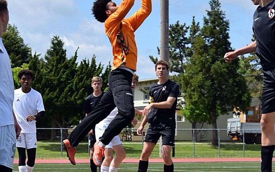 Robert D. Edgren goalkeeper Tariq Lewis skies to stop a shot against Zama during Wednesday's playoff match in the Far East Boys Division II Soccer Tournament, won by the Trojans 6-0.
COKO MAGBY/SPECIAL TO STRIPES