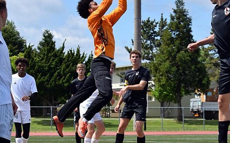 Robert D. Edgren goalkeeper Tariq Lewis skies to stop a shot against Zama during Wednesday's playoff match in the Far East Boys Division II Soccer Tournament, won by the Trojans 6-0.

COKO MAGBY/SPECIAL TO STRIPES