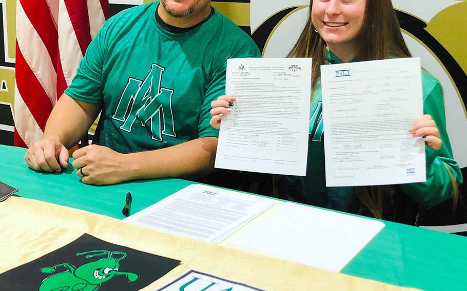 Kaelin Elliott, a Humphreys graduate, displays her signed National Letter of Intent, committing her to running cross country for University of Arkansas at Monticello. Her father, Steven, the Blackhawks' football coach, attended UAM from 1995-96.