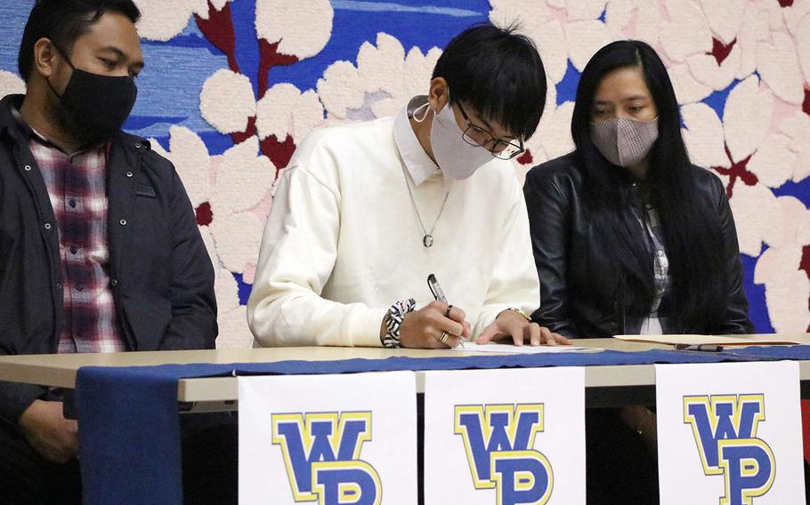 Matthew C. Perry senior Joseph Andres signs an offer to play volleyball at William Penn University in Iowa.