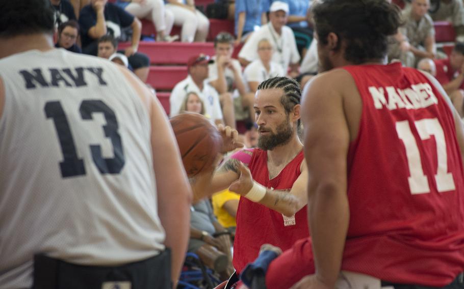 A player gets the ball during the Navy vs Marines basketball match of the Warrior Games on June 23, 2015.