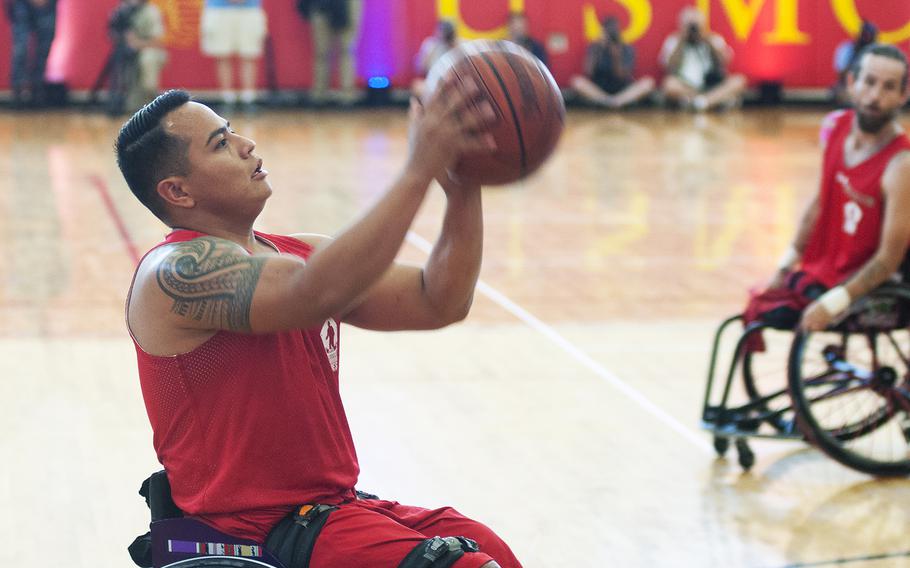 Marcus Chischilly sets and shoots on Tuesday June 23, 2015, during the Warrior Games championship wheelchair basketball matchup between Team Marine Corps and Navy at Quantico Marine Base, Virginia. Team Marine Corps won 57-24.