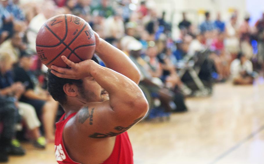 Marine's Matt Grashen sets and shoots for two points on Tuesday June 23, 2015, during the Warrior Games championship wheelchair basketball matchup between Team Marine Corps and Navy at Quantico Marine Base, Virginia. Team Marine Corps won 57-24.