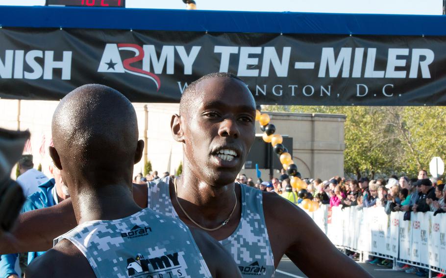 The top finishers congratulate each other after the 31st Army Ten-Miler in Arlington, Va. and Washington, D.C., October 11, 2015.