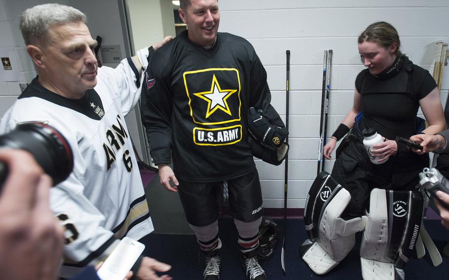 Army coach Gen. Mark Milley and Under Secretary of the Army Patrick Murphy talk to reporters after a hockey game against Navyat Verizon Center in Washington, D.C., Dec. 5, 2016.