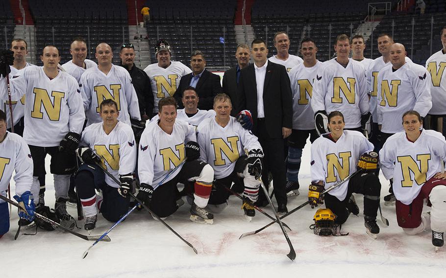 Navy players pose for a team photo after a hockey game at Verizon Center in Washington, D.C., Dec. 5, 2016.