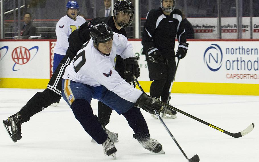 Hockey action between Army and Navy teams at Verizon Center in Washington, D.C., Dec. 5, 2016.