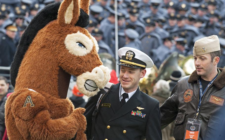 Navy fans meet Army mascot before the Army-Navy football game Dec. 10, 2016, in Baltimore.