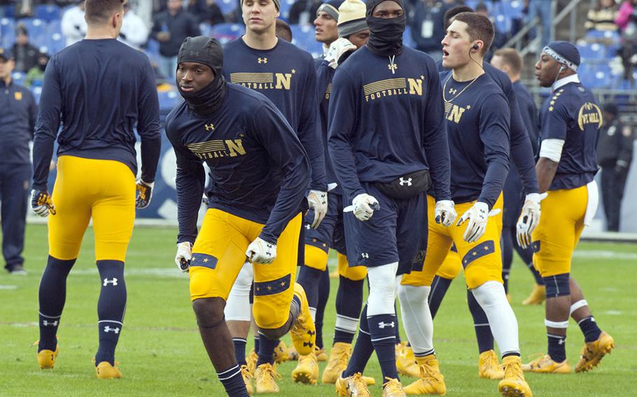 Navy players warm up before the start of the Army-Navy game on Dec. 10, 2016, in Baltimore.