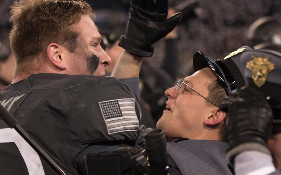 Army players, cadets and fans celebrate after the Black Knights beat the Navy Midshipman in their annual rivalry game, 21-17.