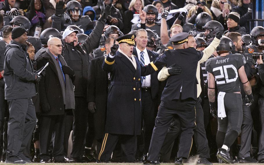 Army Chief of Staff Gen. Mark Milley, center, leads the celebration as the Army-Navy game comes to a close with Army winning, 21-17, at Baltimore on Dec. 10, 2016.
