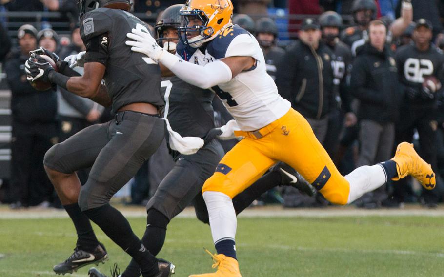 Army's Xavier Moss picks off Navy's Zach Abey in the first half of the 2016 Army-Navy game held in Baltimore, Md., on Dec. 10, 2016. Abey threw a pair of picks, but rushed for two touchdowns in Navy's loss. 