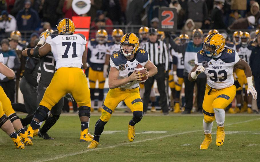 Navy's Zach Abey rolls out during the 2016 Army-Navy game held in Baltimore, Md., on Dec. 10, 2016. Abey rushed for two touchdowns in the Midshipmen's 21-17 loss. 