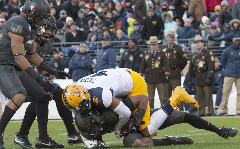 Navy's Jamir Tillman makes a tackle during the Army-Navy game at Baltimore, Dec. 10, 2016.
