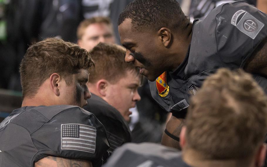 Army players talk it over on the sidelines during their game against Navy, which they eventually won, 21-17, at Baltimore on Dec. 10, 2016.