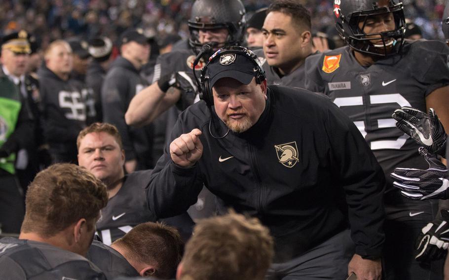 Army players get instructions on the sidelines during their game against Navy, which they eventually won, 21-17, at Baltimore on Dec. 10, 2016.